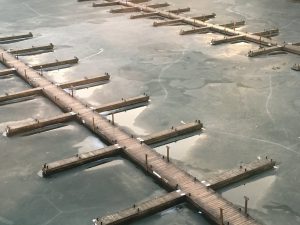 A permanent dock that's been winterized but does not have a deicing system