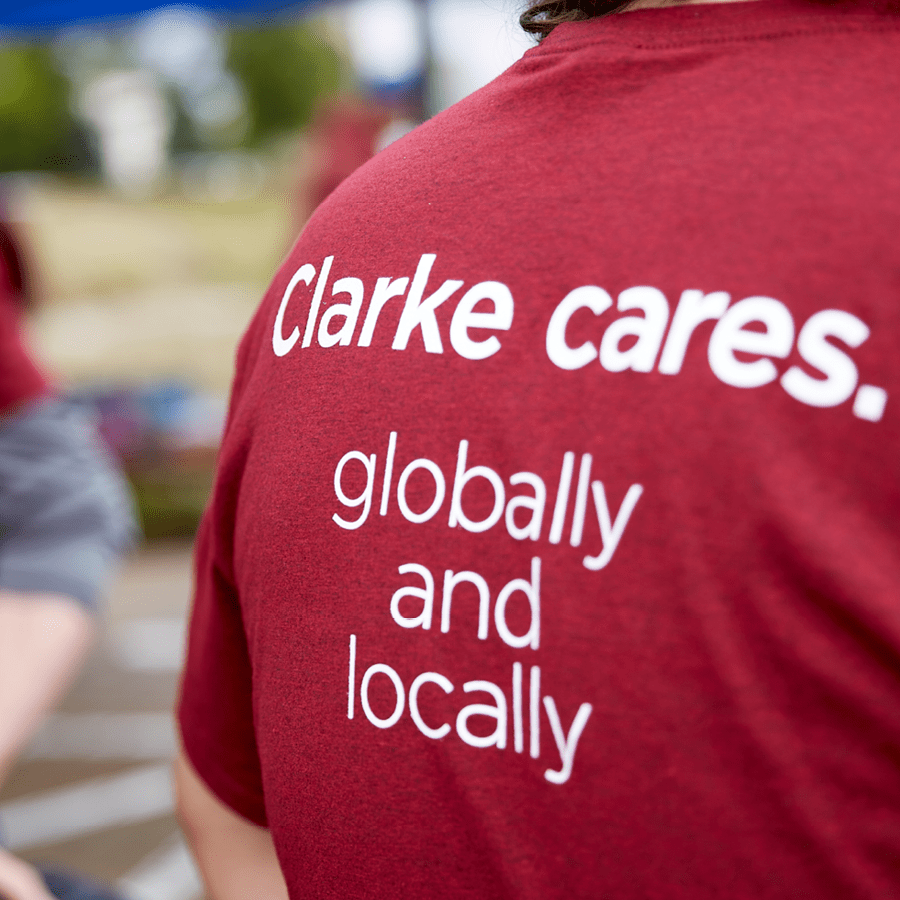 clarke cares local global tshirt