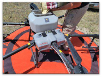 A drone being filled with a mosquito control granule product
