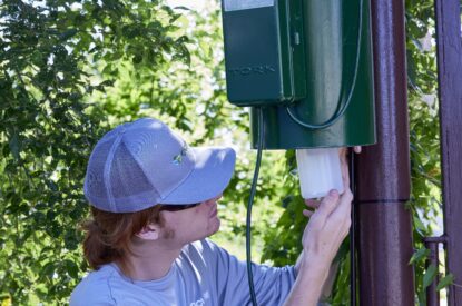 A Technician Adjusting A New Jersey Light Trap 1