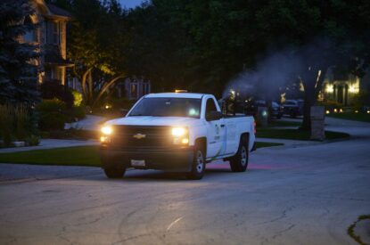 A Truck Spraying Adult Mosquitoes With An ULV Sprayer