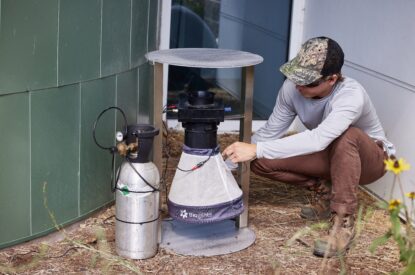 A Technician Adjusting A BG Pro Trap With A BG Counter