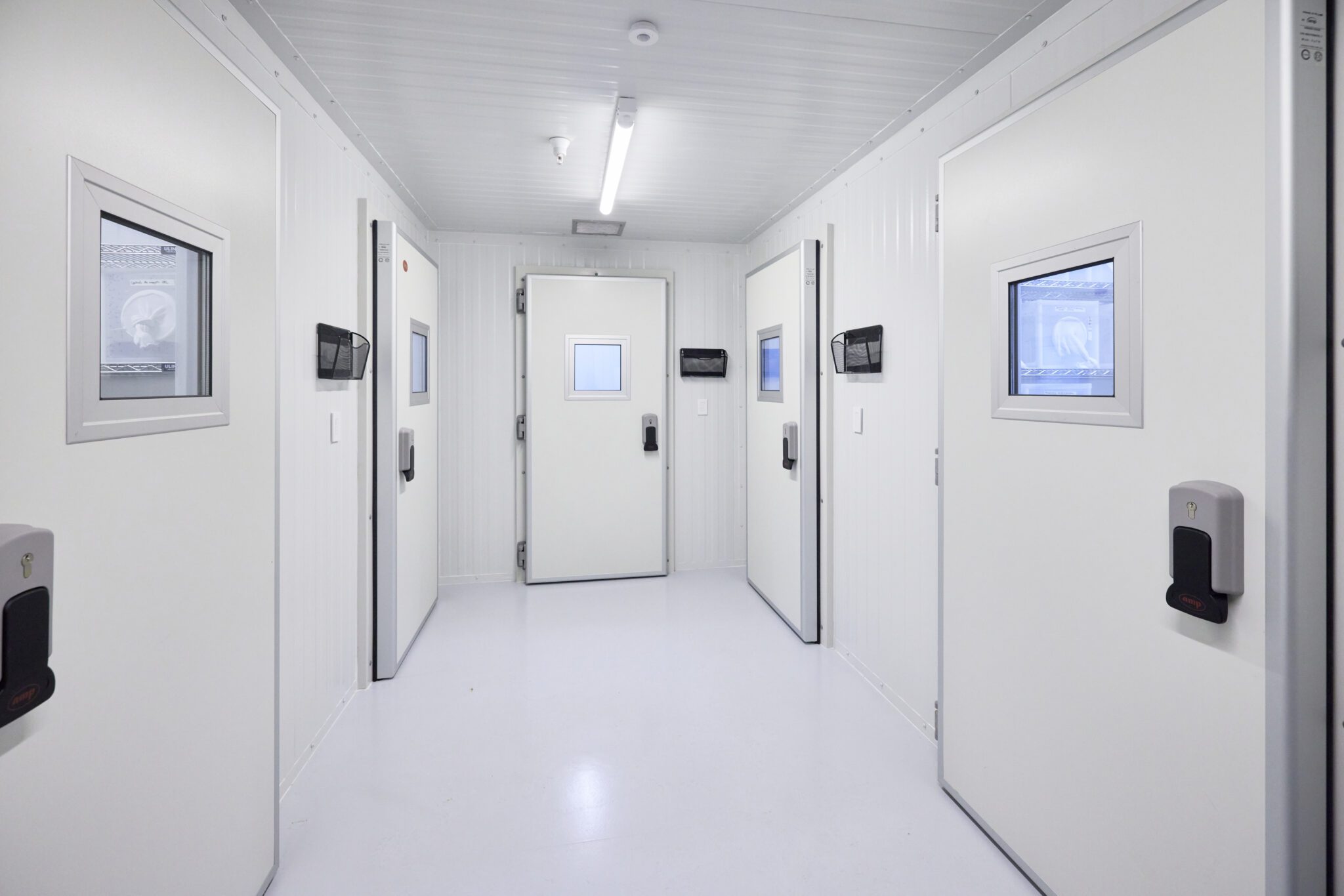 Interior of mosquito control insectary with controlled access chambers and research rooms